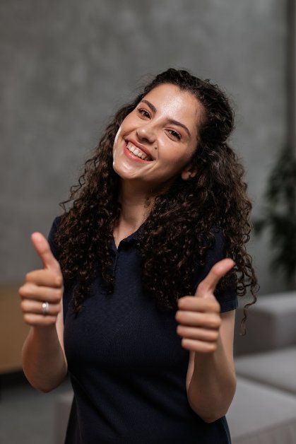 Happy client giving a thumbs up after loan approval
