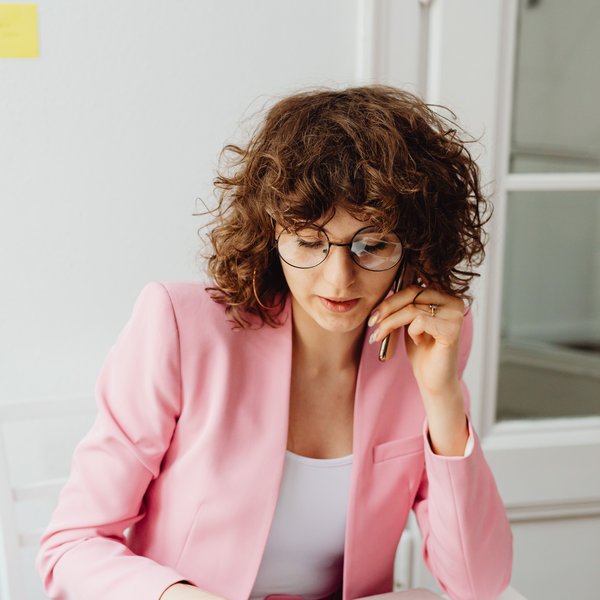 Client discussing her finance goals on the phone